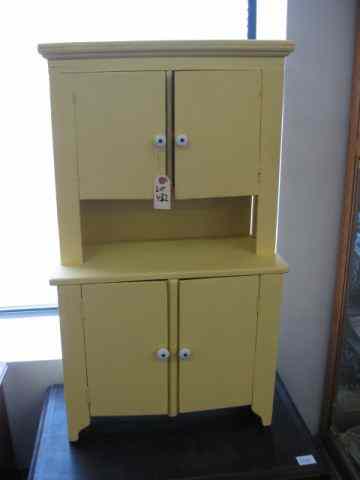 Appraisal: Child's Size Stepback Cupboard two-doors over two lower doors yellow