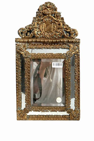 Appraisal: A Dutch Baroque style repousse mirror height in width in