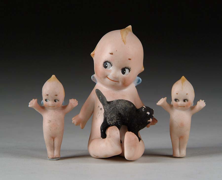 Appraisal: LOT OF KEWPIES Includes seated Kewpie with black cat on