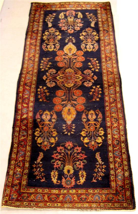 Appraisal: Antique Persian carpet Sarouk design blue field central polychromatic paisley