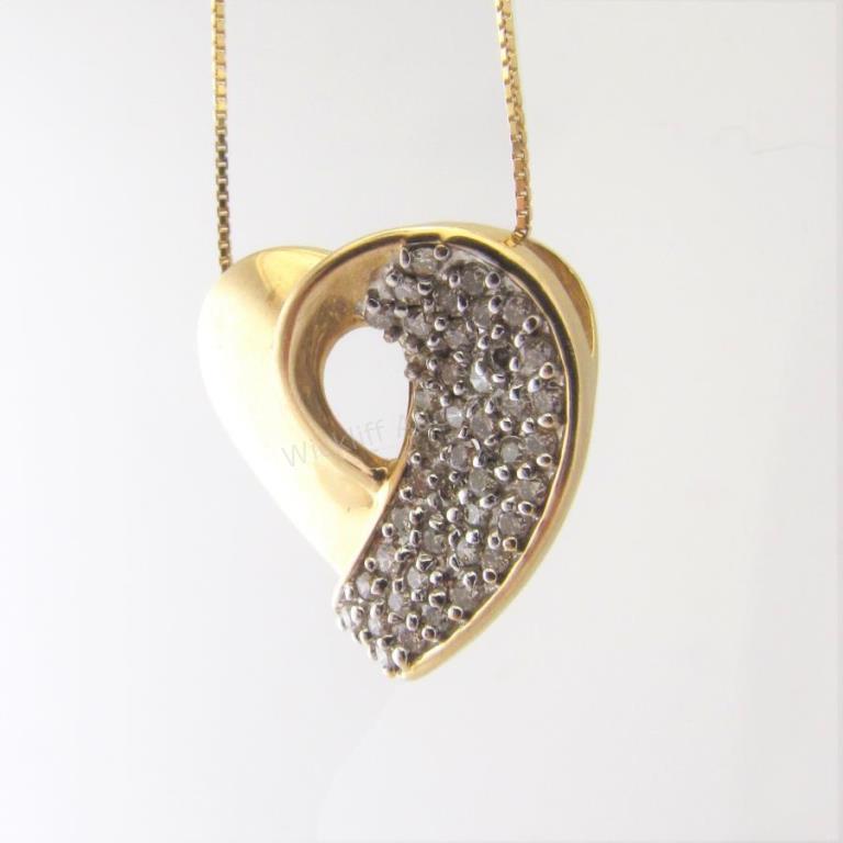 Appraisal: A K yellow gold heart pendant containing approximately ctw of