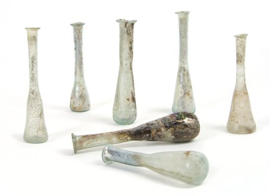 Appraisal: A Collection of Seven Roman Glass Unguentariums Height of tallest