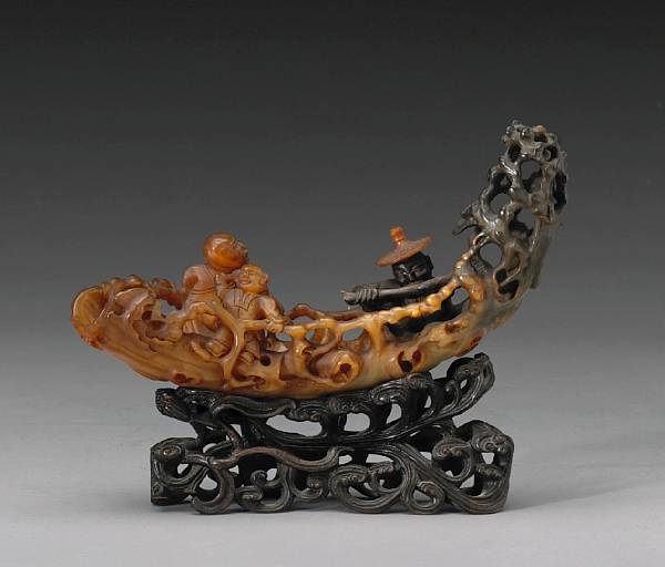 Appraisal: A carved water buffalo horn Deeply undercut to depict three