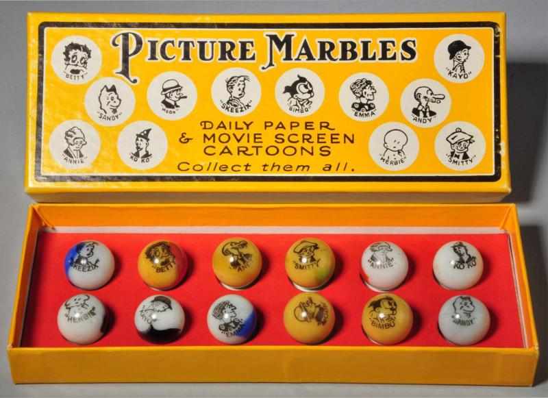 Appraisal: Box Set of Peltier Comic Marbles Description Set of original