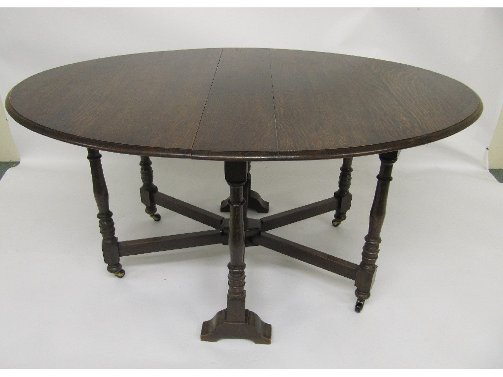 Appraisal: An oak gateleg dining table circa raised on turned legs