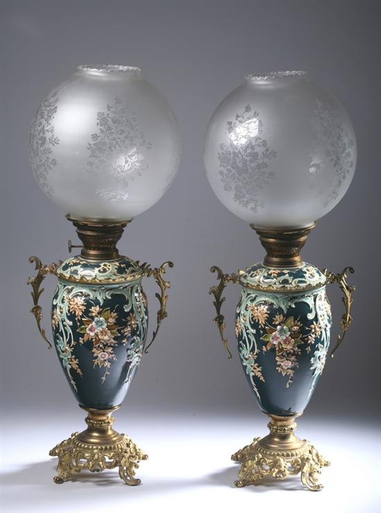 Appraisal: PAIR CONTINENTAL OIL LAMPS Polychrome porcelain on teal ground Ormolu