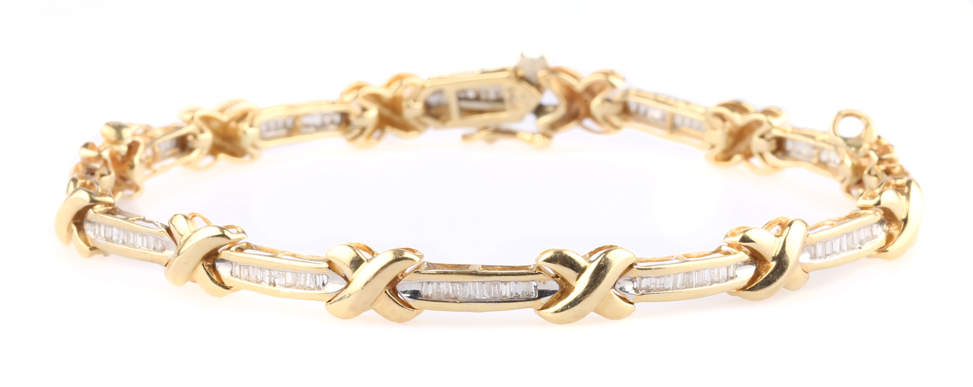 Appraisal: A Straight-Line Diamond Bracelet K x motif with baguette diamonds