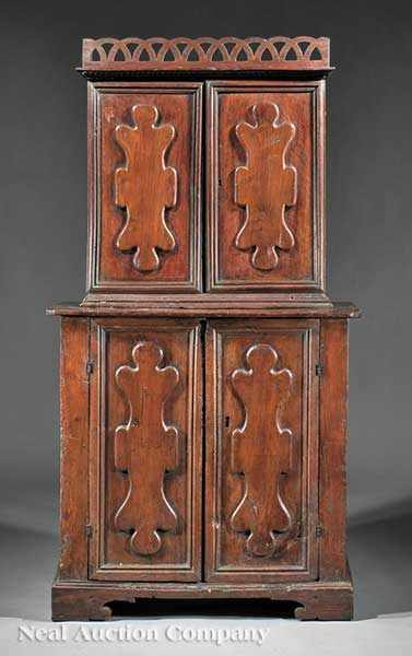 Appraisal: An Antique Italian Carved Walnut Cupboard th c reticulated pediment