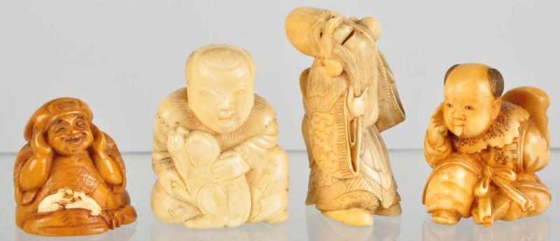 Appraisal: Lot of Ivory Netsukes Description Includes one man with dog