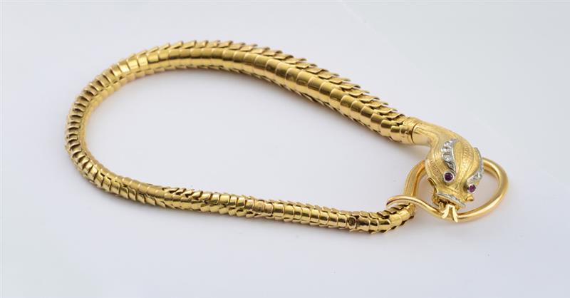 Appraisal: K GOLD SNAKE NECKLACE ABATE Polished and textured link body