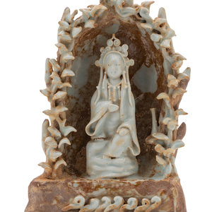 Appraisal: A Chinese Yingqing Glazed Porcelain Guanyin Shrine the guanyin modelled