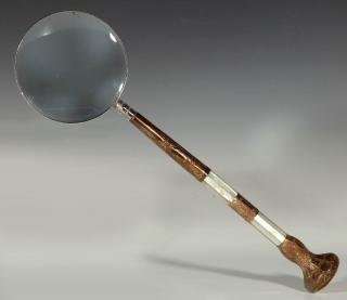 Appraisal: A MAGNIFYING GLASS WITH ANTIQUE MOTHER OF PEARL HANDLE The