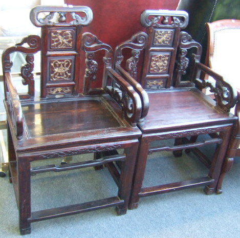 Appraisal: A pair of th century hardwood carved wedding chairs each