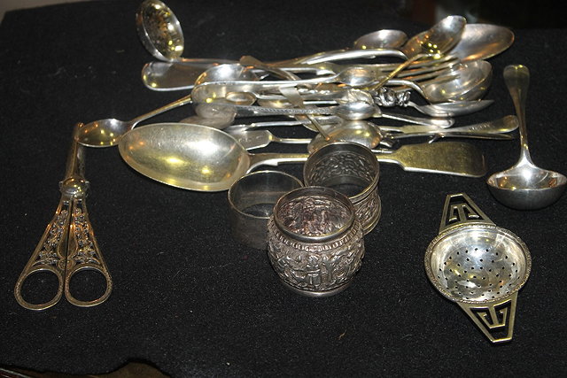 Appraisal: A COLLECTION OF MISCELLANEOUS SILVER SPOONS a tea strainer a