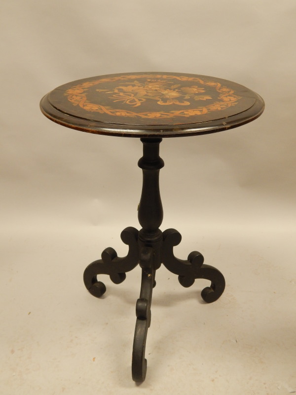 Appraisal: A Victorian ebonised occasional table the circular top with poker