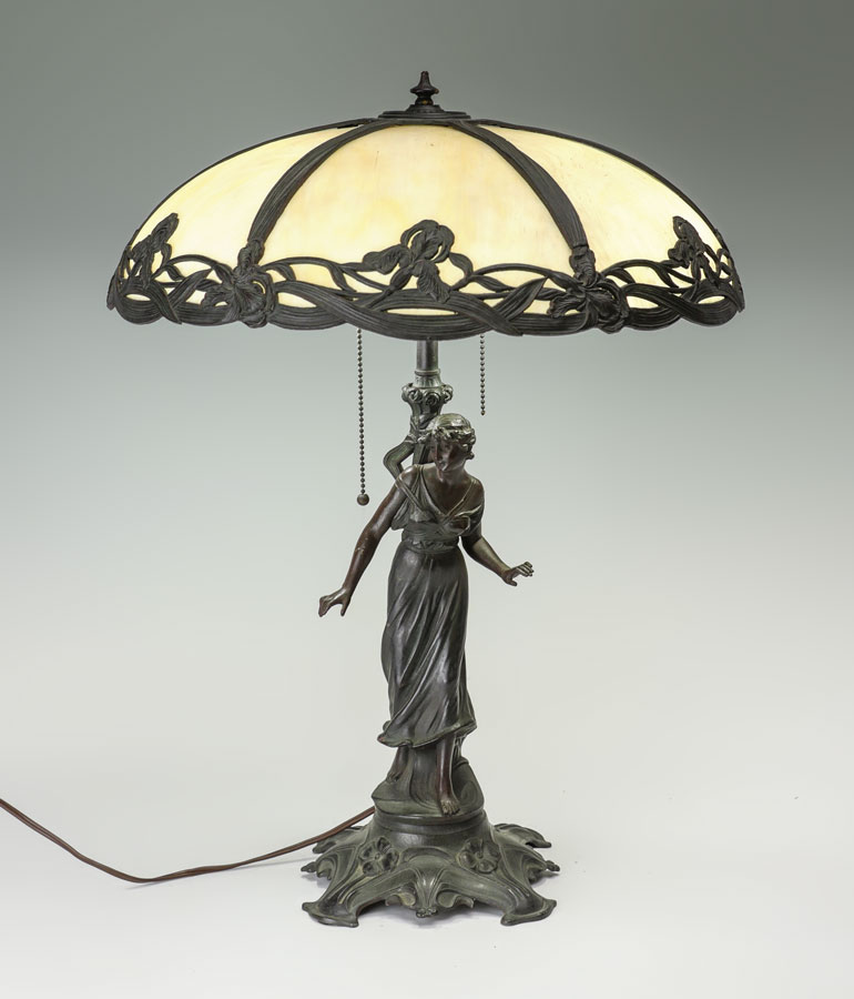 Appraisal: FIGURAL SLAG GLASS TABLE LAMP Patinated spelter figure of a