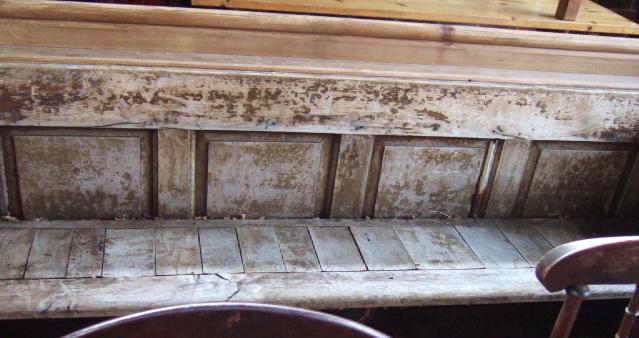 Appraisal: A th century pine pew with four panel back cm