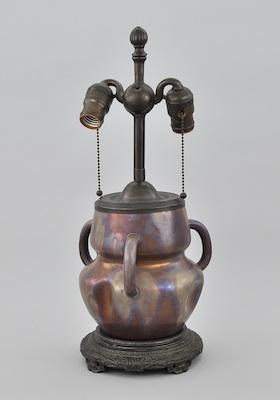 Appraisal: A Pottery Lamp Attributed to Massier With a dimpled body