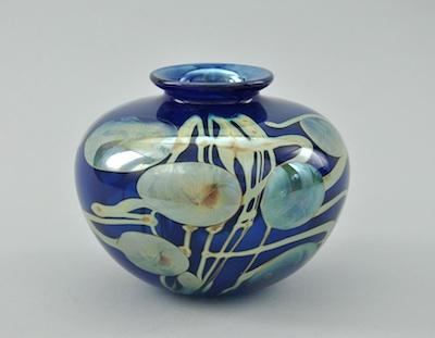 Appraisal: An Art Glass Blue Vase With Iridescent Decorations by Dick