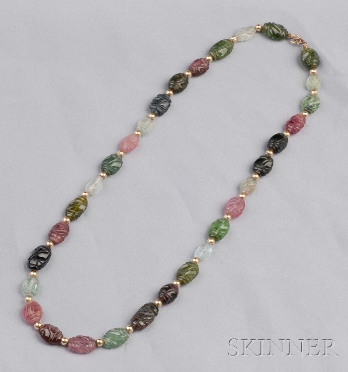 Appraisal: Carved Tourmaline Necklace of various colors spaced by gold beads