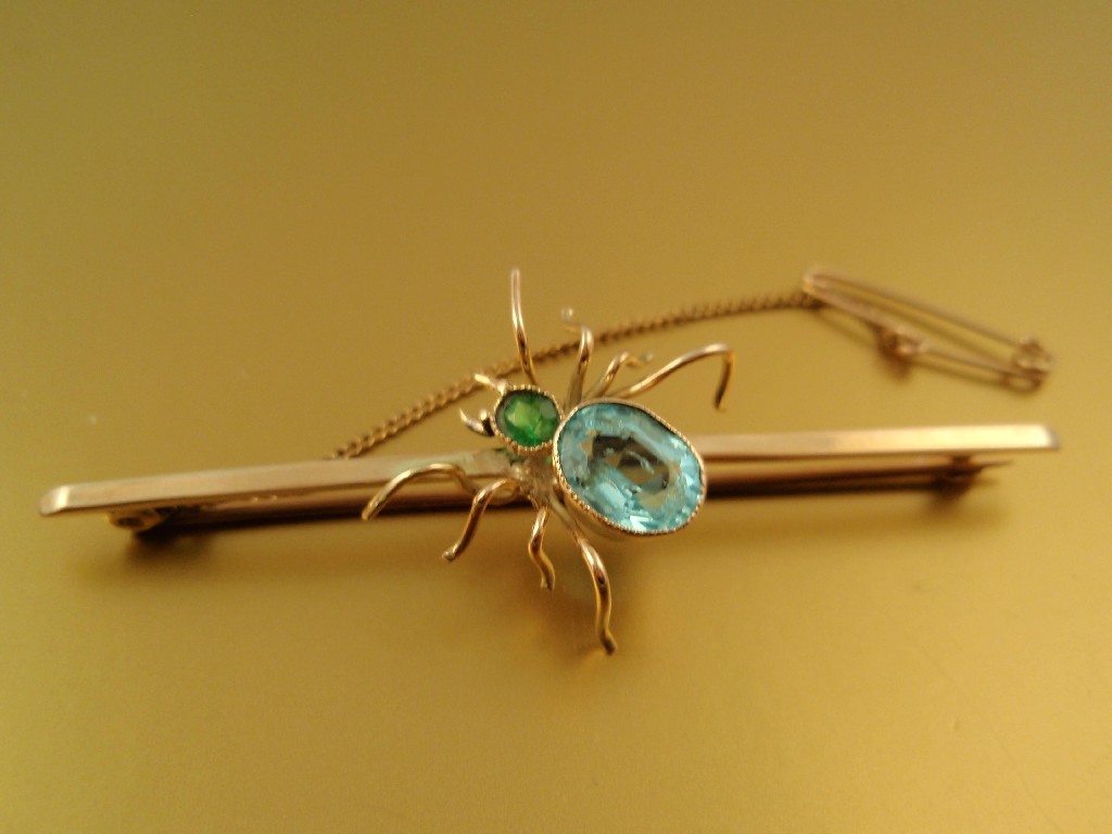 Appraisal: An Edwardian bar brooch with spider attached with turquoise stone