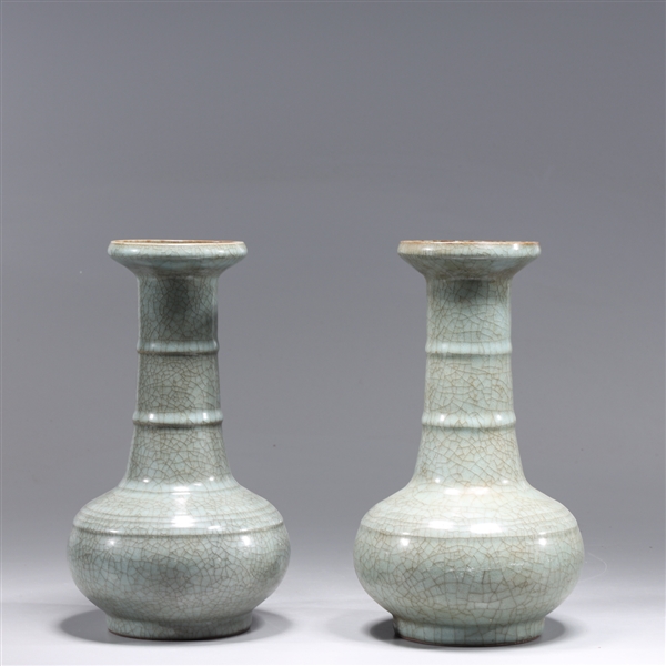 Appraisal: Two Chinese celadon porcelain vases with molded circles to body