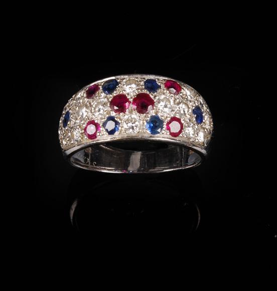 Appraisal: A ruby sapphire and diamond band ring by Cartier the