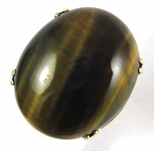 Appraisal: TIGER'S EYE AND EIGHTEEN KARAT GOLD RING set with a