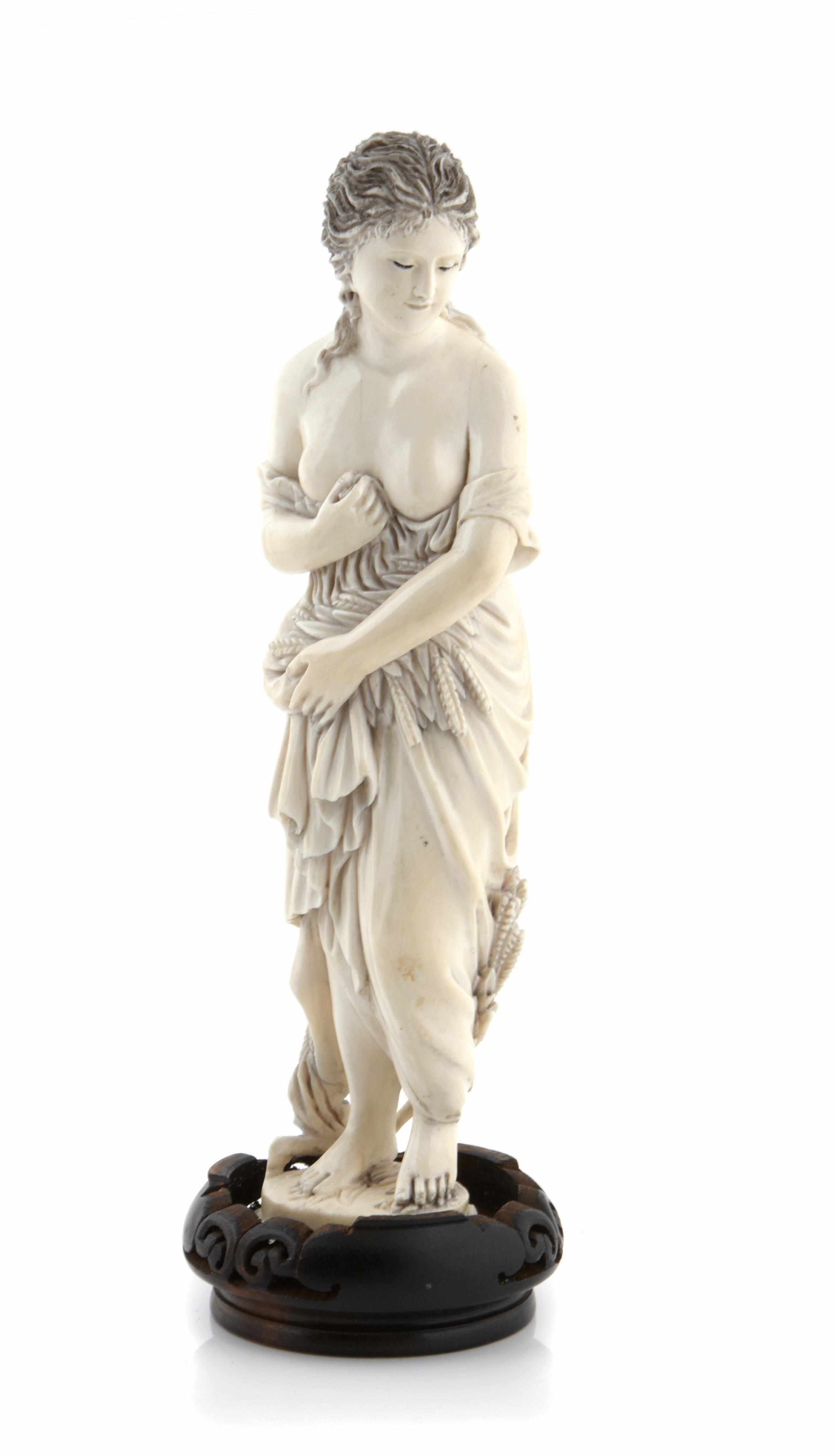 Appraisal: A Continental carved ivory figure emblematic of autumn height excluding