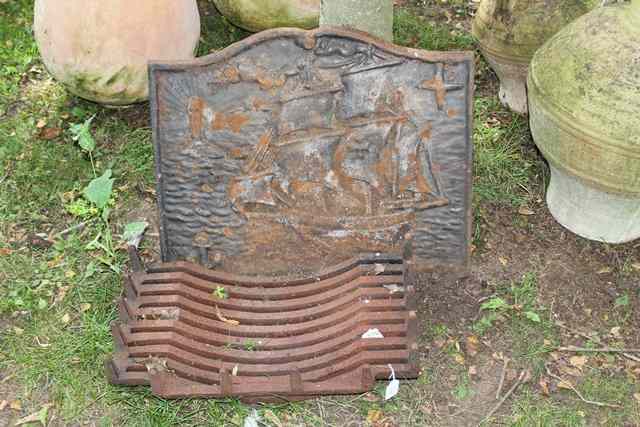 Appraisal: A CAST IRON FIRE BACK decorated with a ship wide