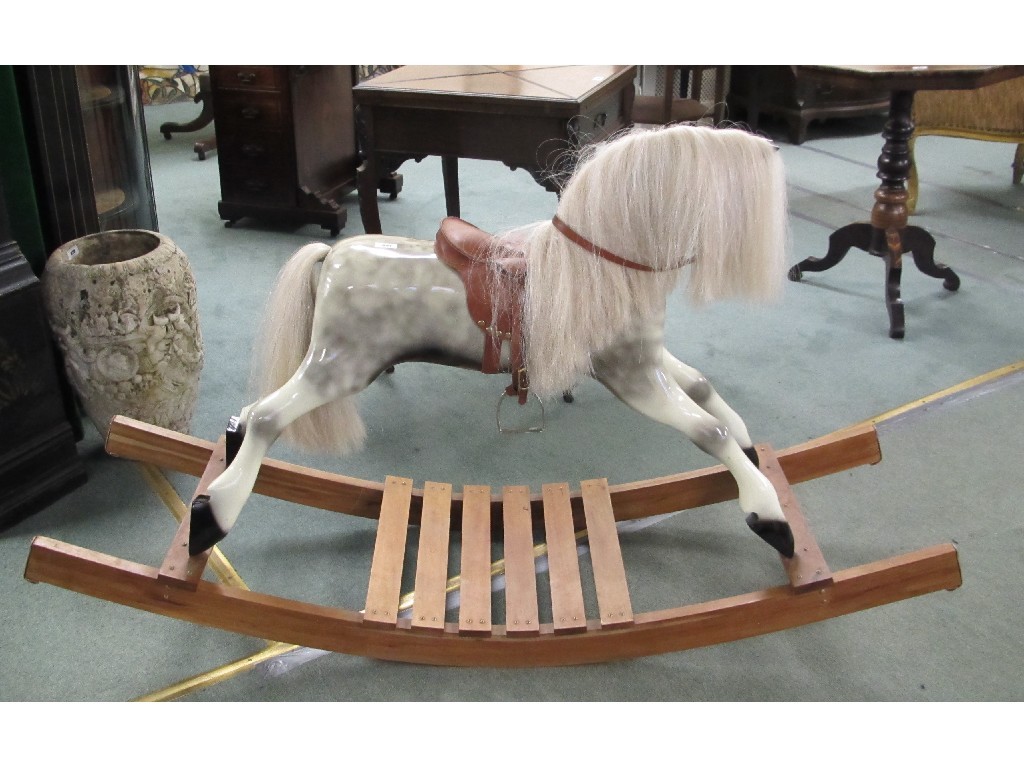 Appraisal: A hand carved dapple grey rocking horse by Ivan Watt