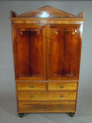 Appraisal: A George IV rosewood linen press the architectural pediment over