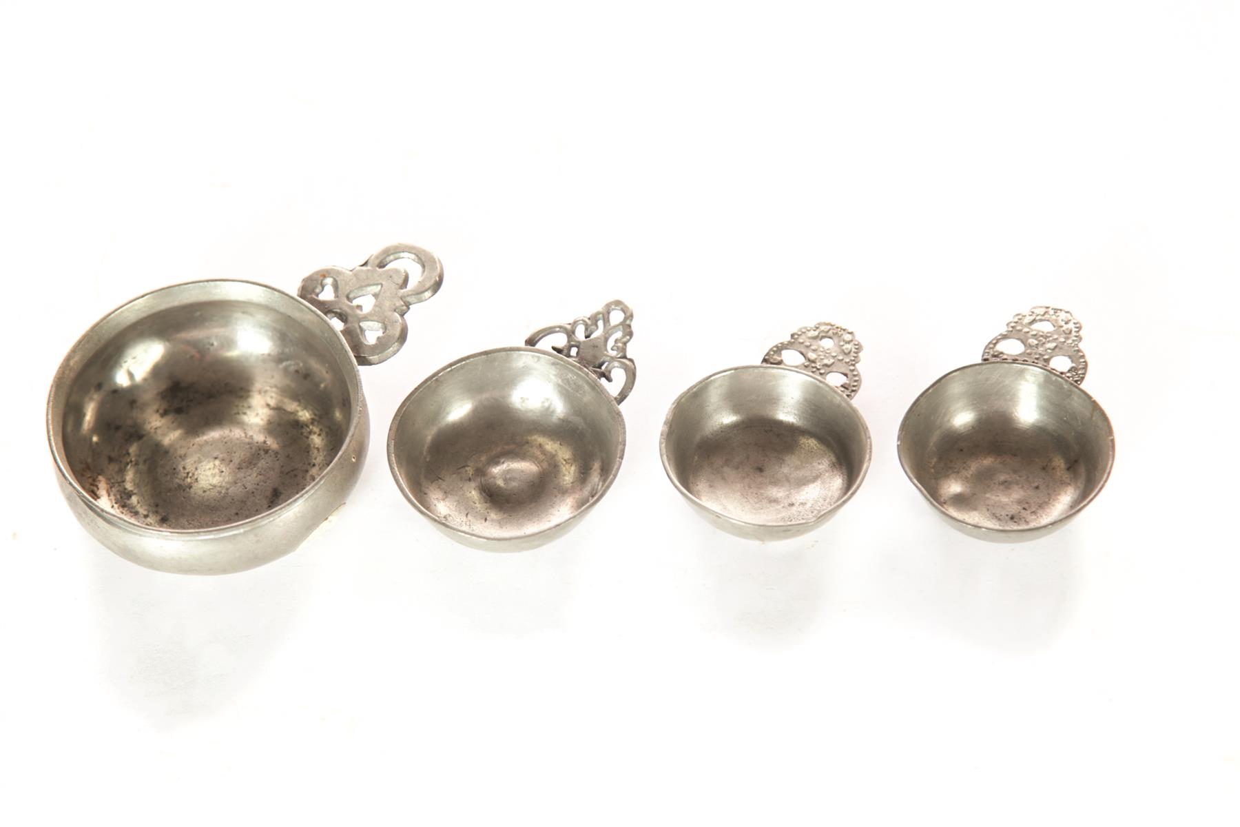 Appraisal: FOUR AMERICAN PEWTER PORRINGERS Early th century Three tasters with