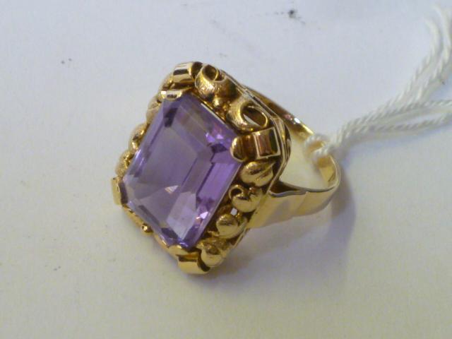 Appraisal: AN AMETHYST DRESS RING the emerald cut amethyst claw set