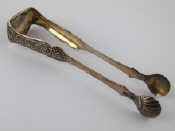 Appraisal: A pair of Russian silver sugar tongs with shell grips