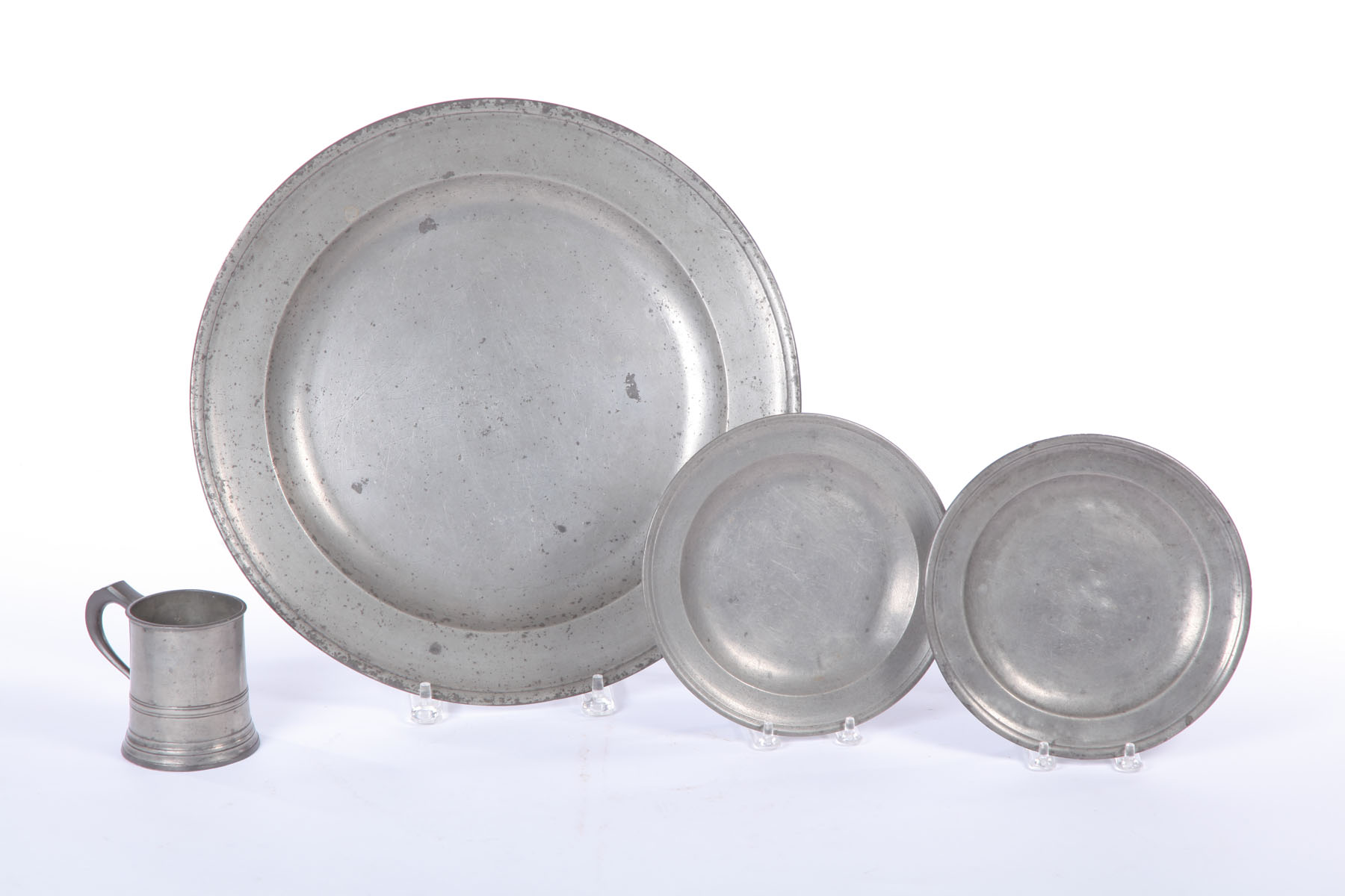 Appraisal: FOUR PIECES OF PEWTER England late th- th century Charger