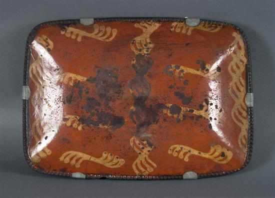 Appraisal: Pennsylvania redware square serving bowl th century with stylized yellow