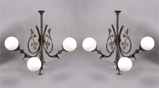 Appraisal: A Pair of Cast Iron Three-Light Sconces Height inches