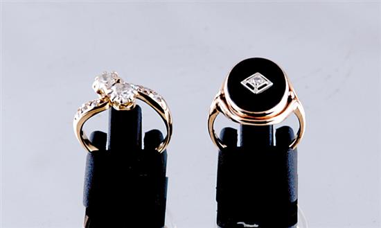 Appraisal: Diamond and gold rings oval black onyx stone centered with