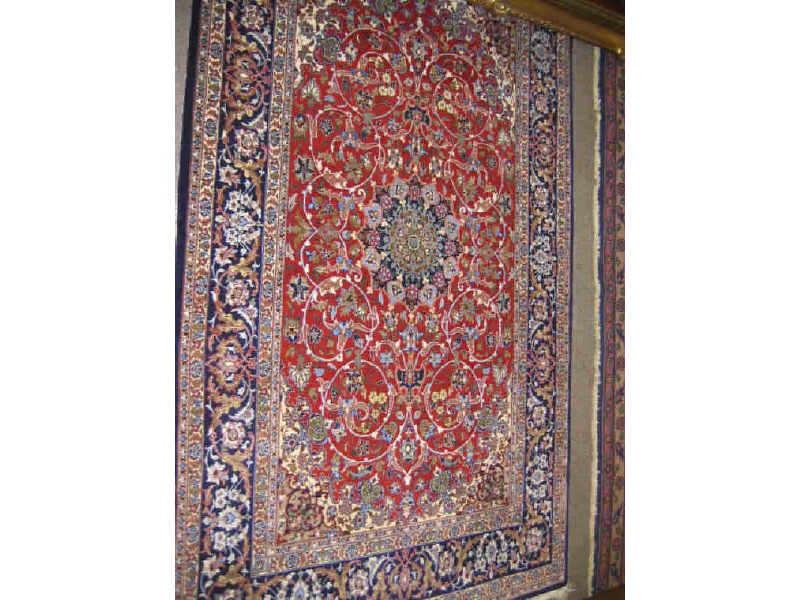 Appraisal: ISFAHAN THROW RUG The red field of curvilinear floral design