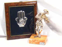 Appraisal: A framed silver hand of Fatima together with an Israeli