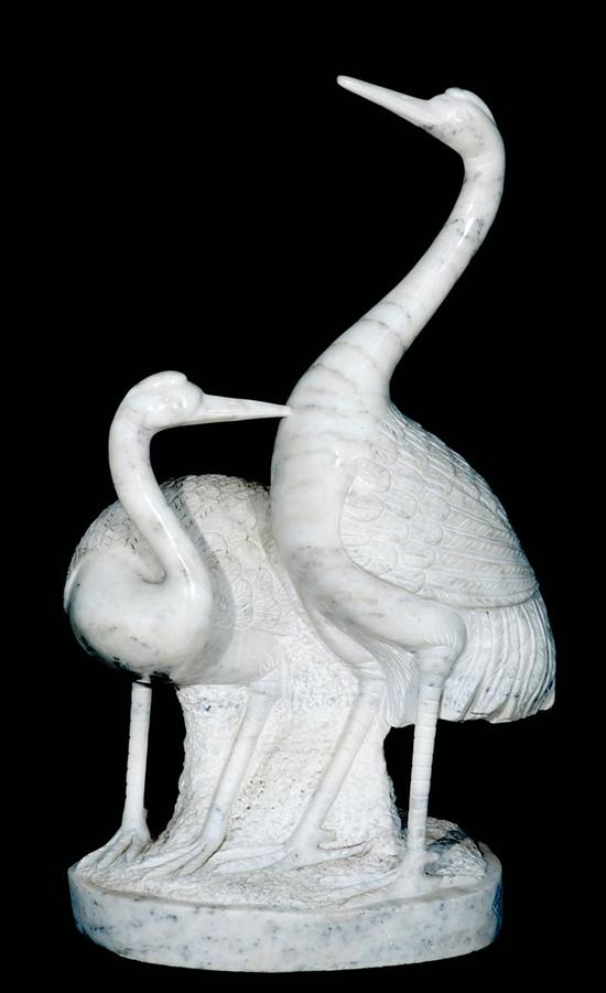 Appraisal: Continental school th century STANDING CRANES carved marble on base