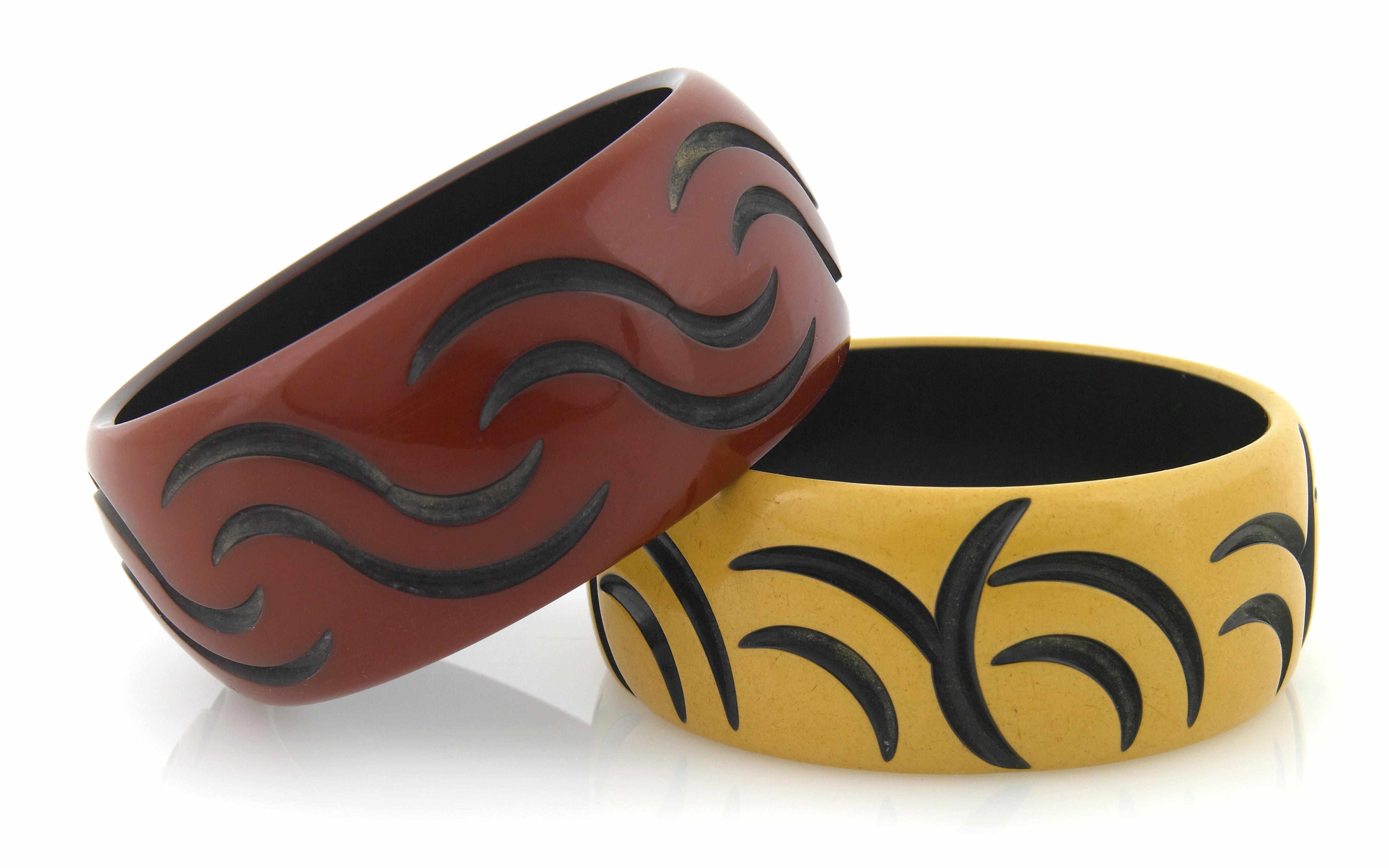 Appraisal: Two two-tone cast carved bangle bracelets each diameter in