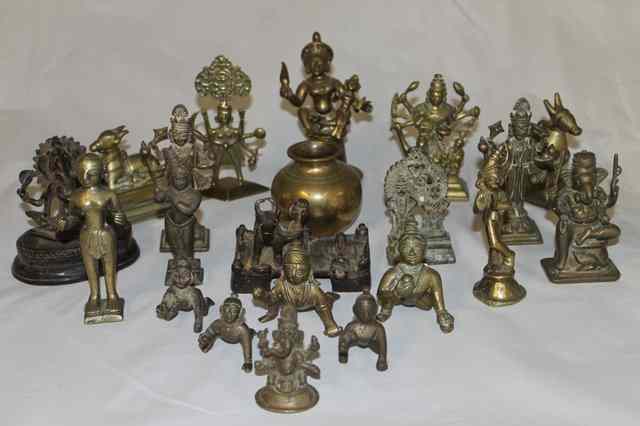 Appraisal: A COLLECTION OF TWENTY ONE INDIAN BRONZE AND BRASS DEITIES