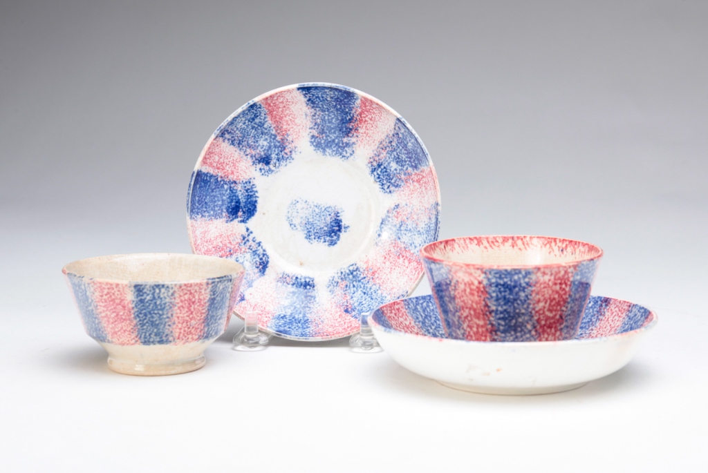 Appraisal: TWO ENGLISH RAINBOW SPATTER CUPS AND SAUCERS Second quarter th