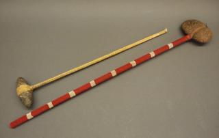 Appraisal: Plains stone bead club Two Plains bead and rawhide clubs