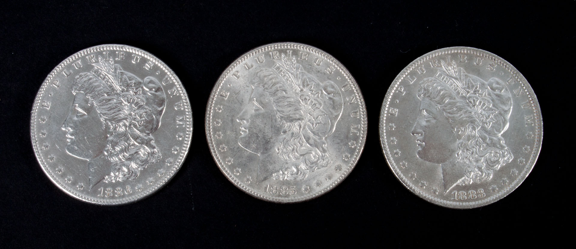 Appraisal: Three United States Morgan silver dollars -' comprising -O and