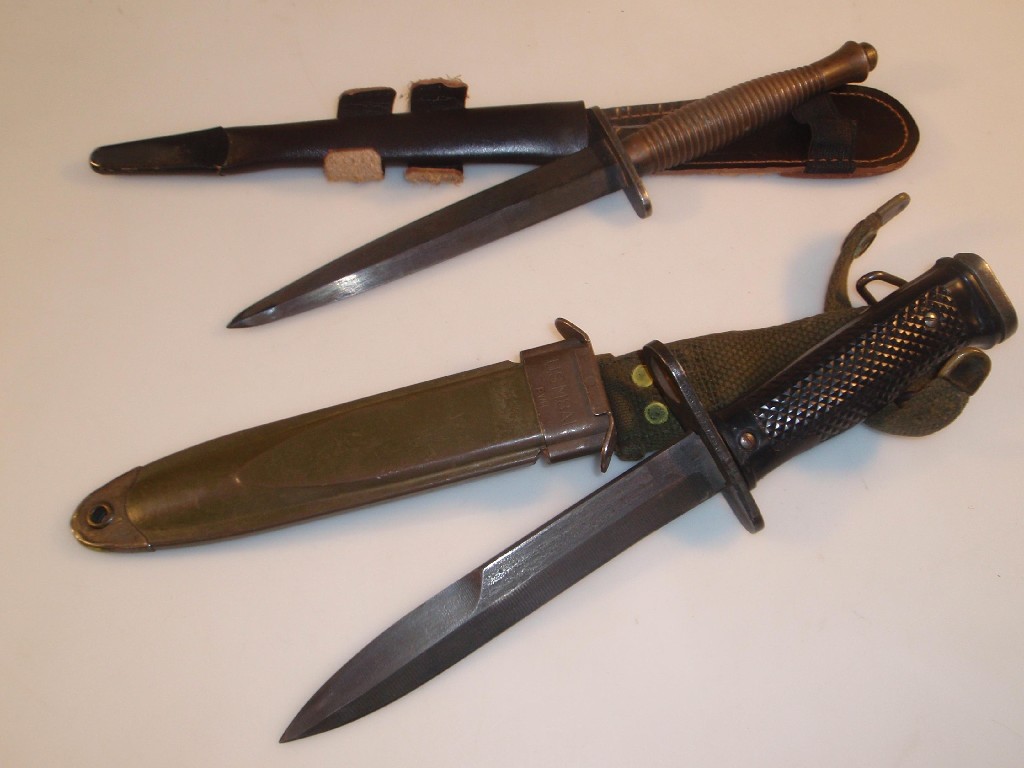 Appraisal: A WWII Fairburn Sykes Commando fighting knife with scabbard and