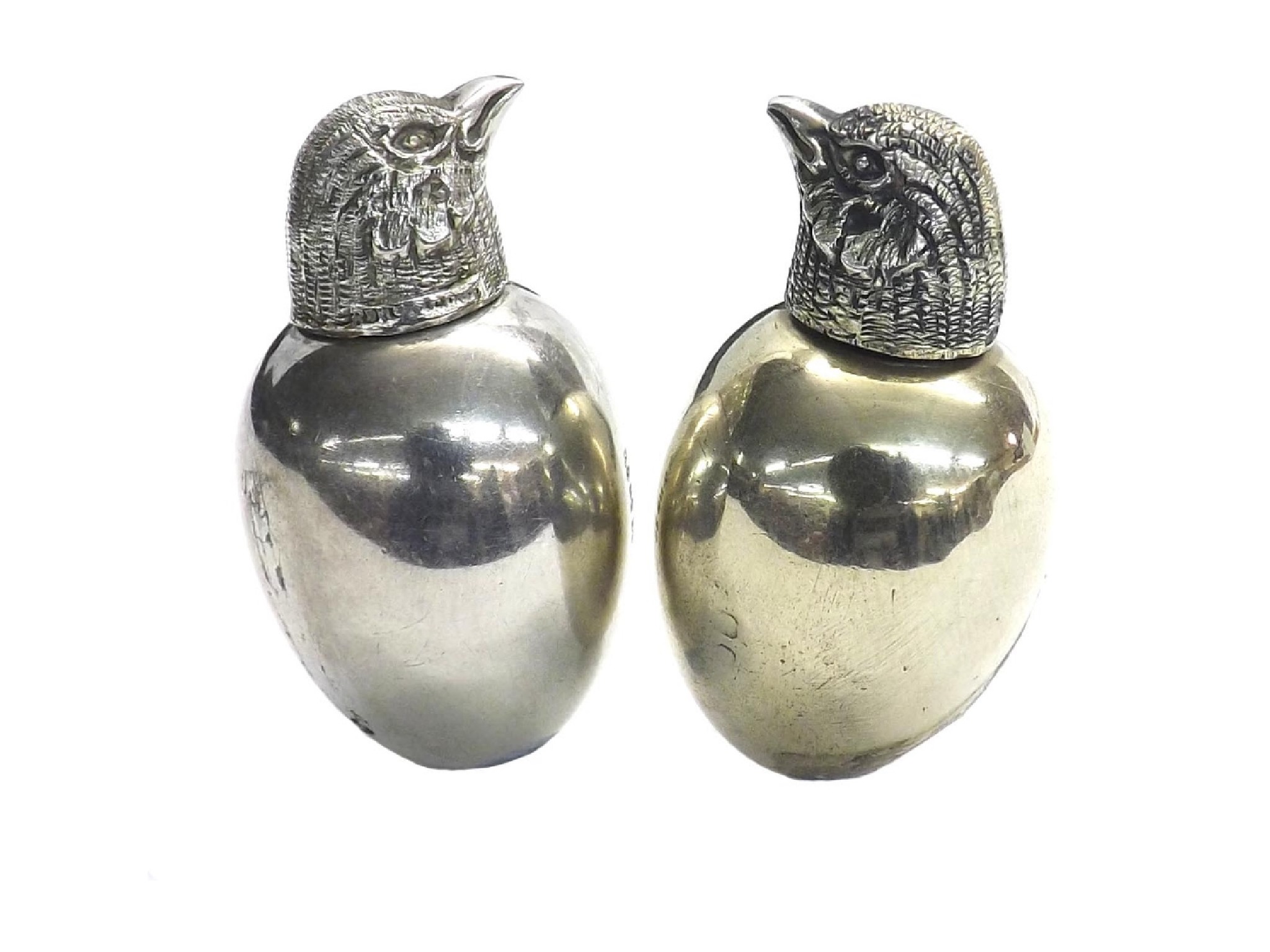 Appraisal: Two similar silver novelty 'chick' egg shaped scent bottles Chester