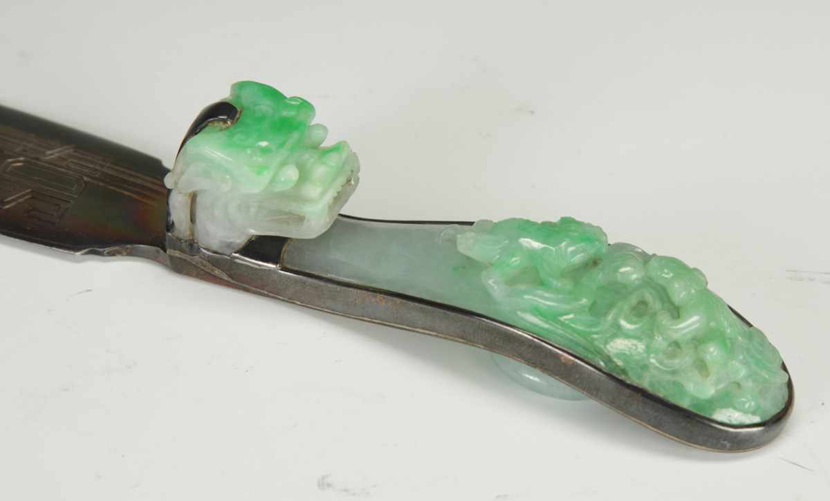 Appraisal: Carved Jade Belt Hook With carved dragon heads and sea